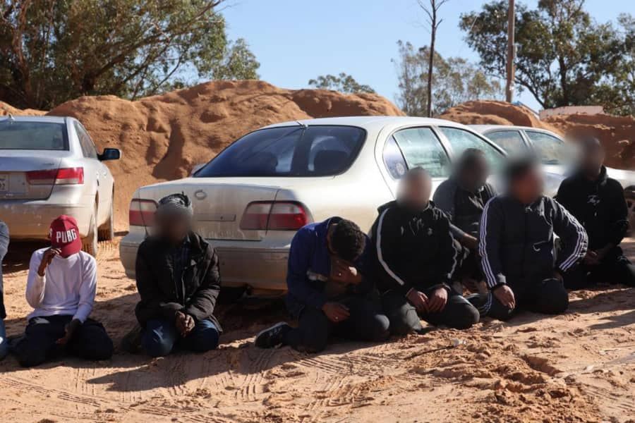 May be an image of 6 people, car and Uluru